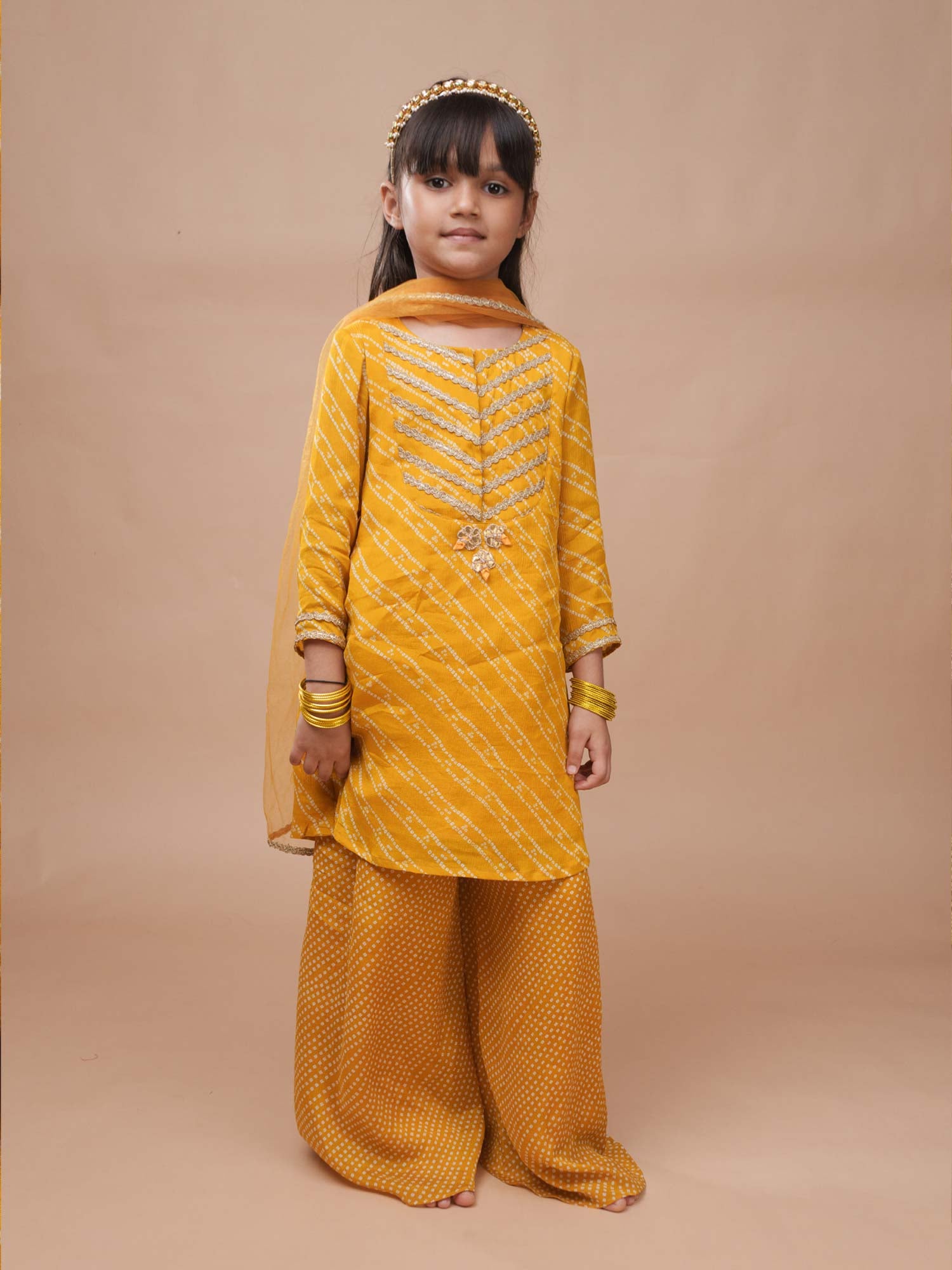 Sunhera Bandhej mustard yellow sharara set with gold lace for girls Ñ StorytellersJunior Gota Patti