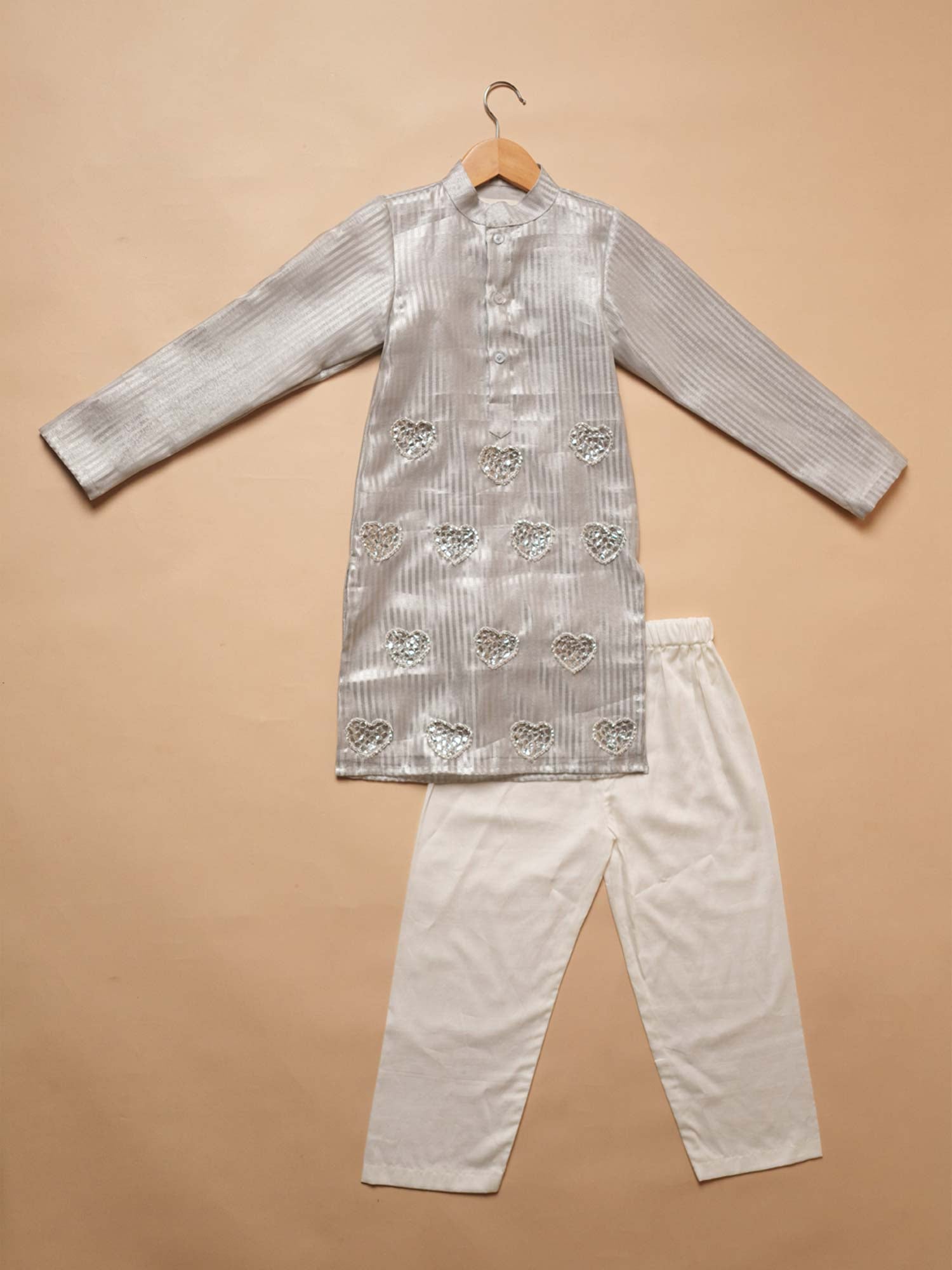 Flat lay view of the Chand silver gota Kurta Set featuring a striped chanderi kurta and classic white pajamas.