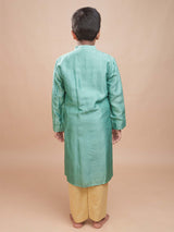 Back view of a boy wearing the Hara Gul Charm Kurta Set, showing the fit of the mint green bamber silk kurta.