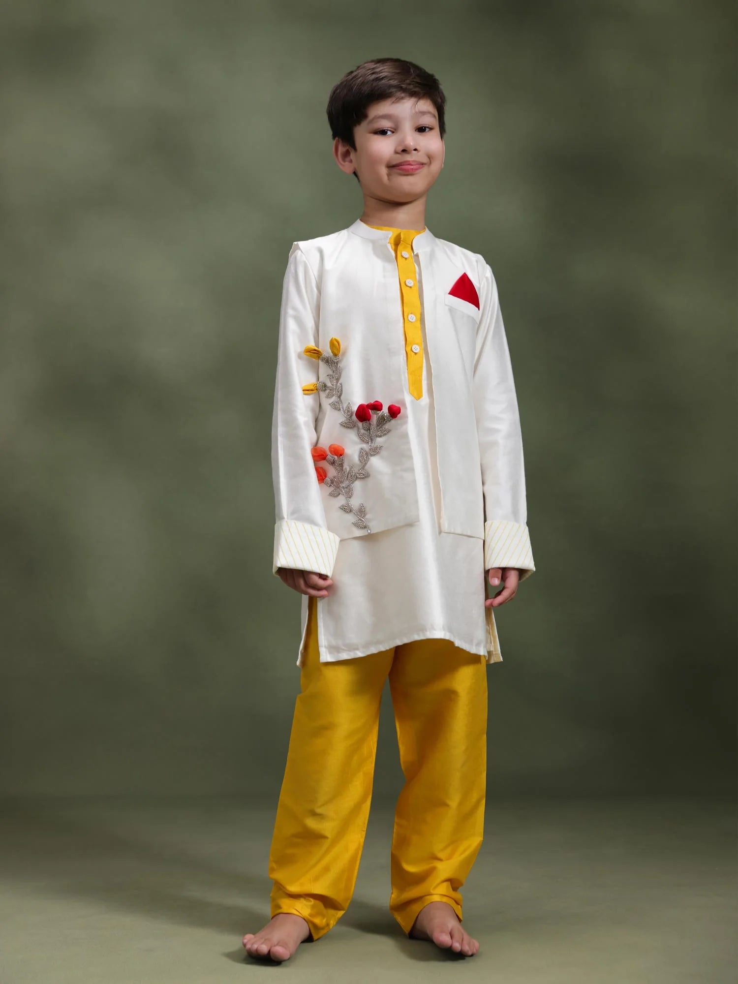 Boy wearing Storytellers Junior Aryan Ivory Bloom Jacket Set with handcrafted floral appliquŽ jacket