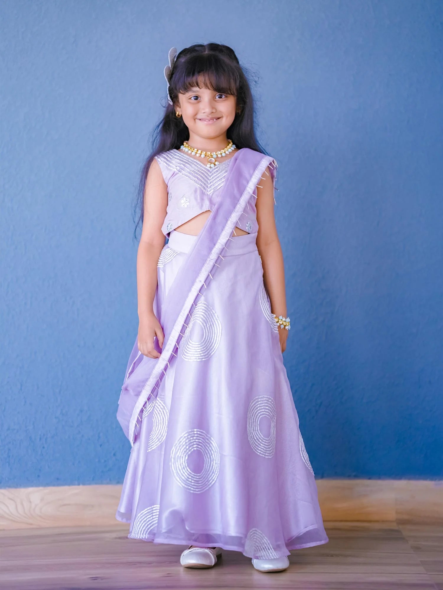 Girl wearing Storytellers Junior Meera Lavender Gota Lehenga Set with gota embroidery and organza dupatta