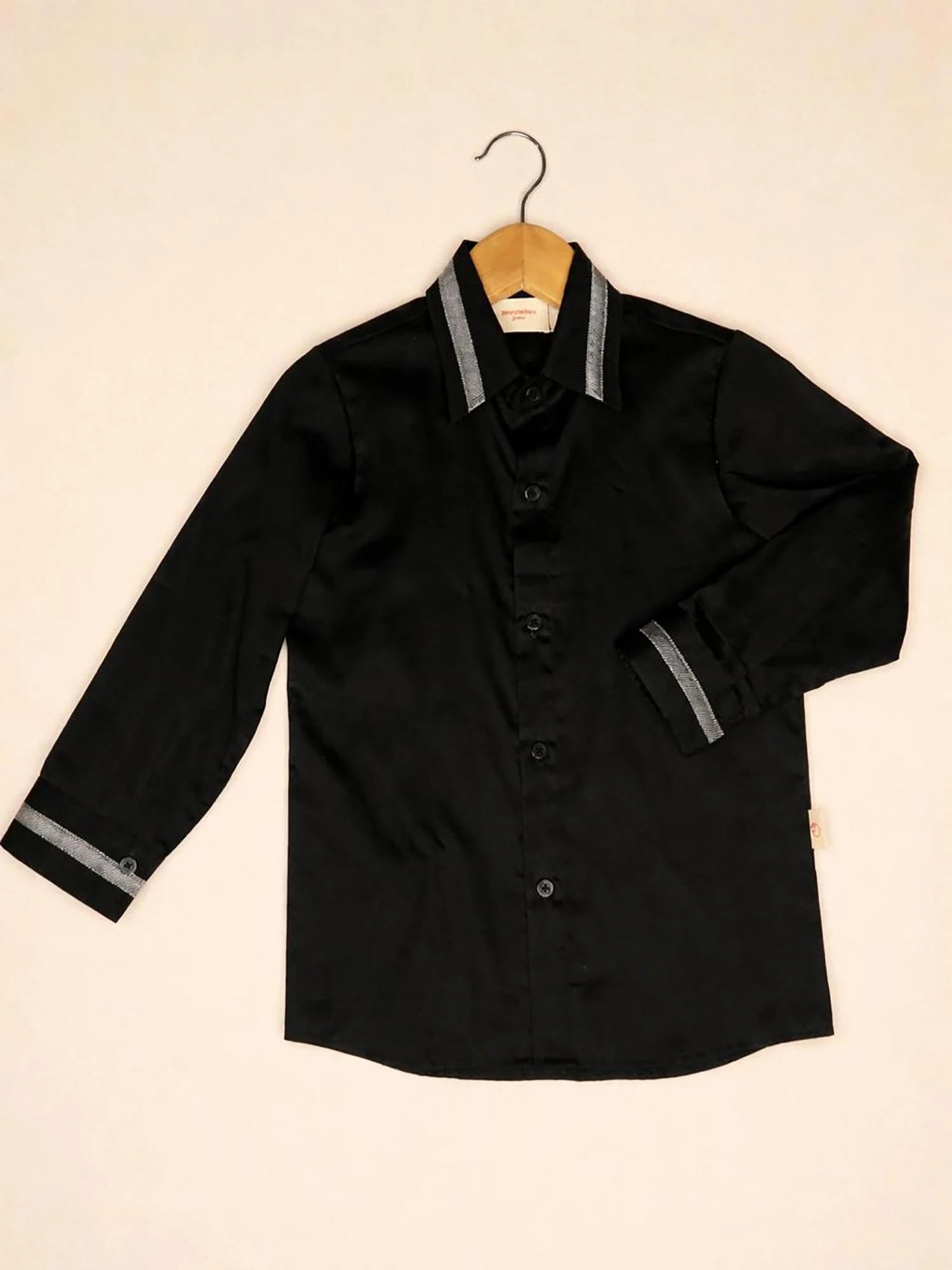 Boy wearing Storytellers Junior Finn Silver Trim Party Shirt in black with silver collar detail