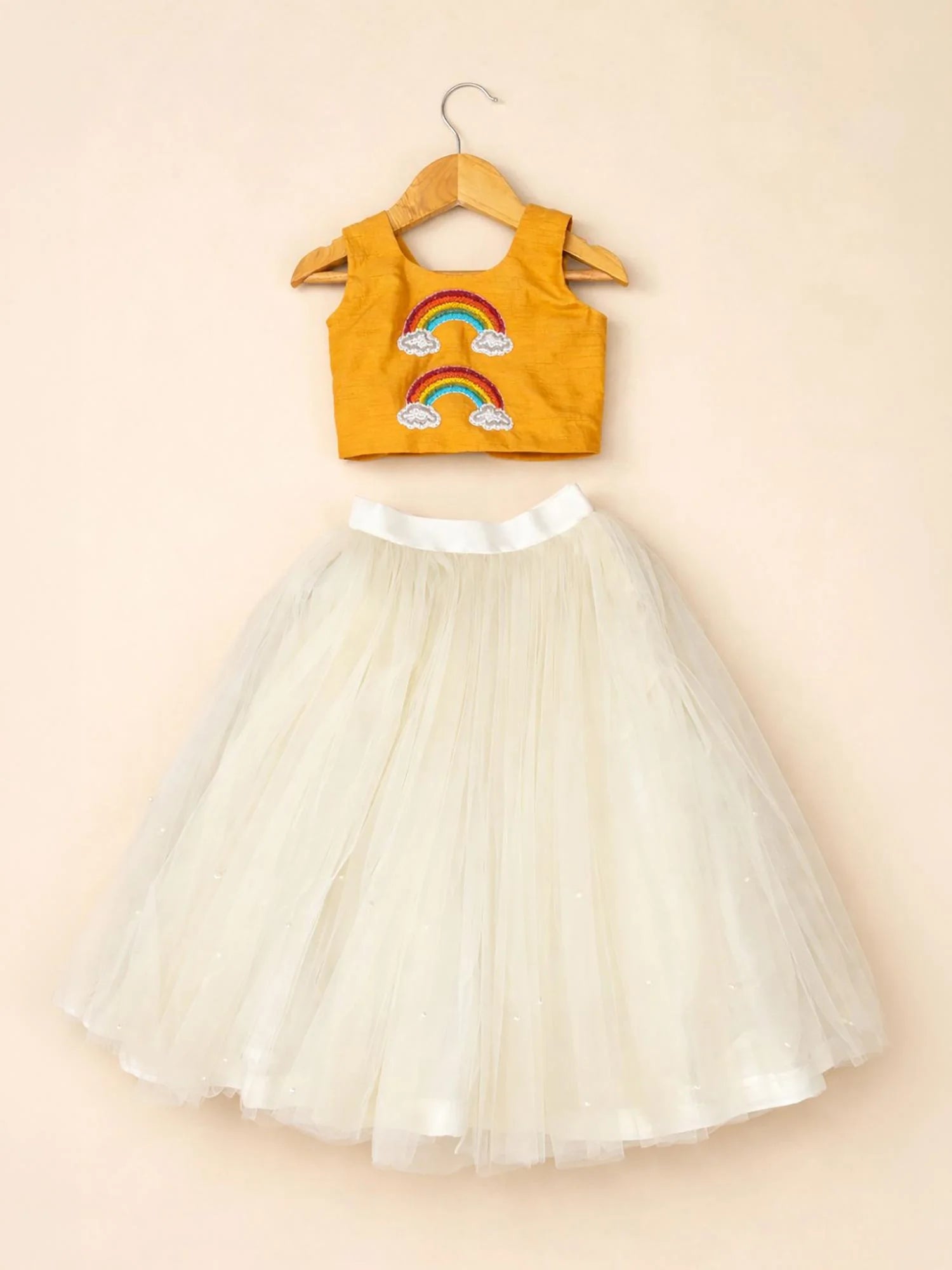 Girl wearing Storytellers Junior Iris Rainbow Tulle Skirt Set in mustard and ivory tulle