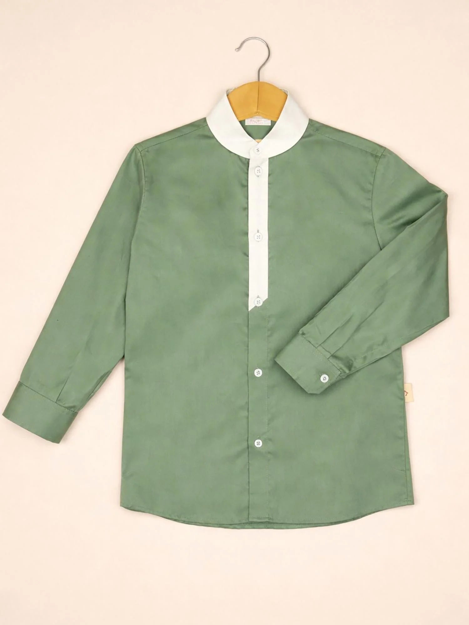 Boy wearing Storytellers Junior Ezra Sage Green Designer Shirt with white contrast collar