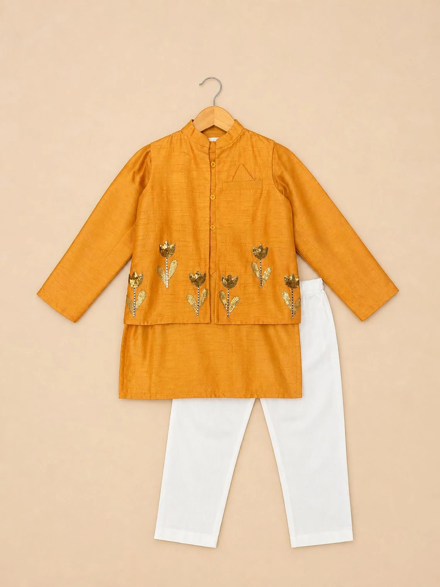 Boy wearing Storytellers Junior Veer Mustard Floral Jacket Set with embroidered jacket and white pants