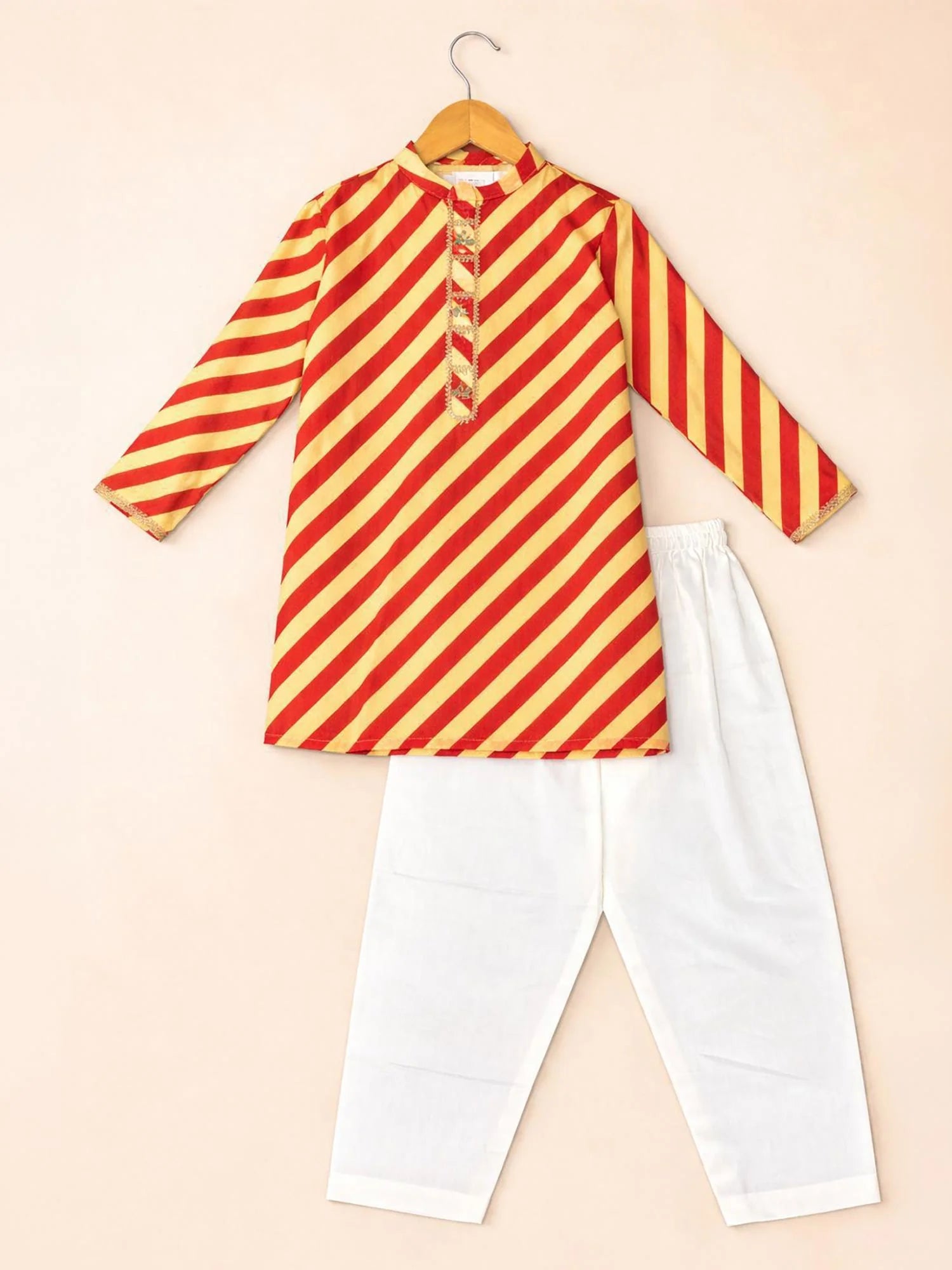 Boy wearing Storytellers Junior Arjun Striped Festive Kurta Set in red and yellow with white pants