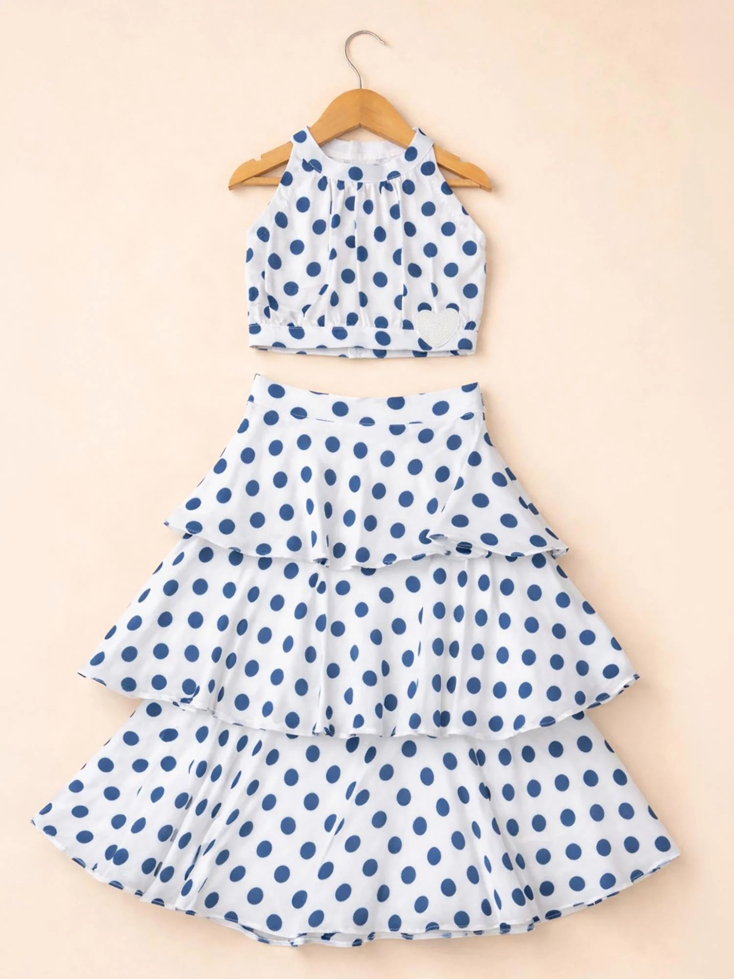 Girl wearing Storytellers Junior Blythe Polka Dot Co-Ord Set in blue and white with tiered ruffle skirt