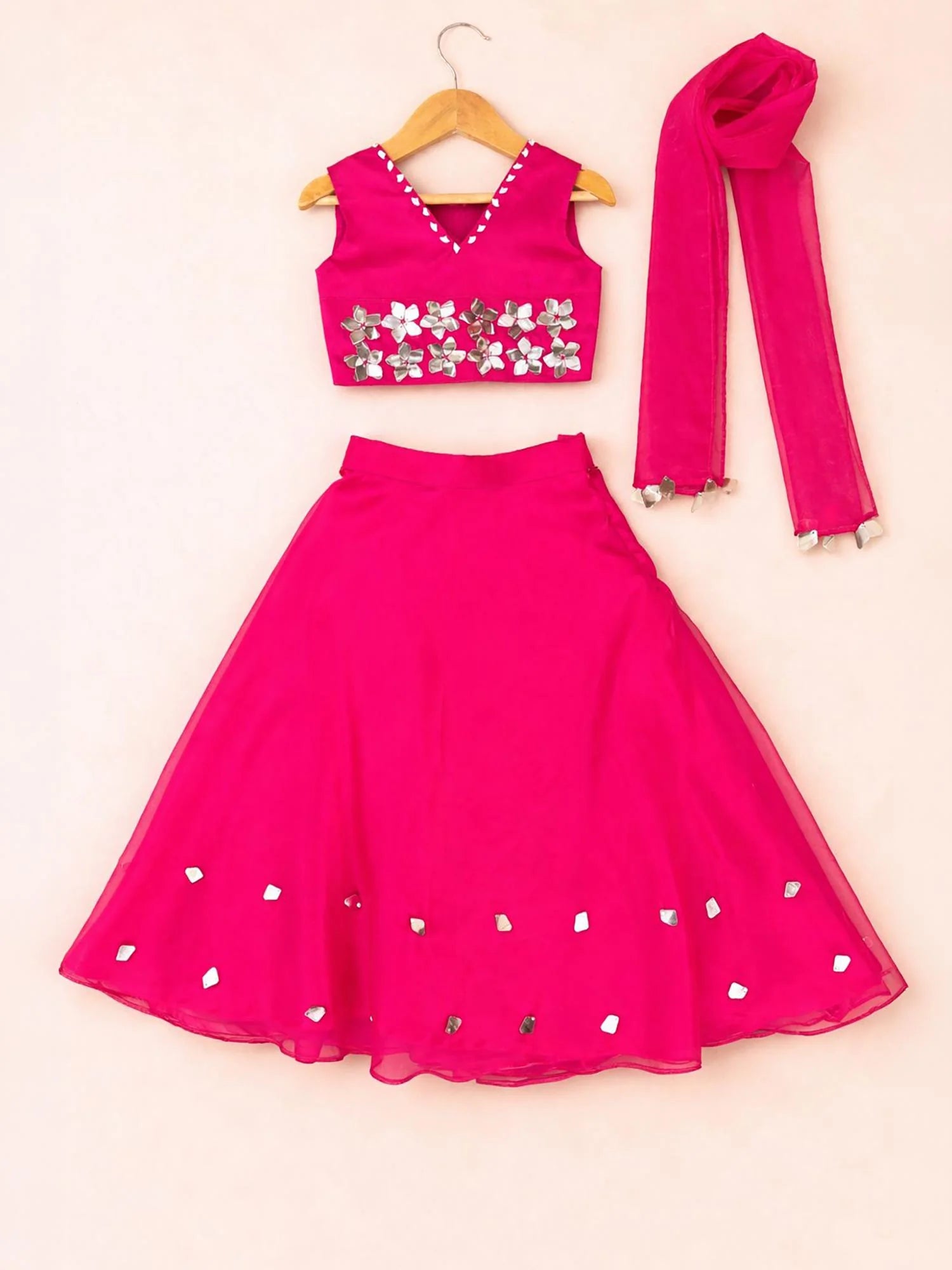 Girl wearing Storytellers Junior Raya Pink Mirror Lehenga Set with mirror work blouse and dupatta