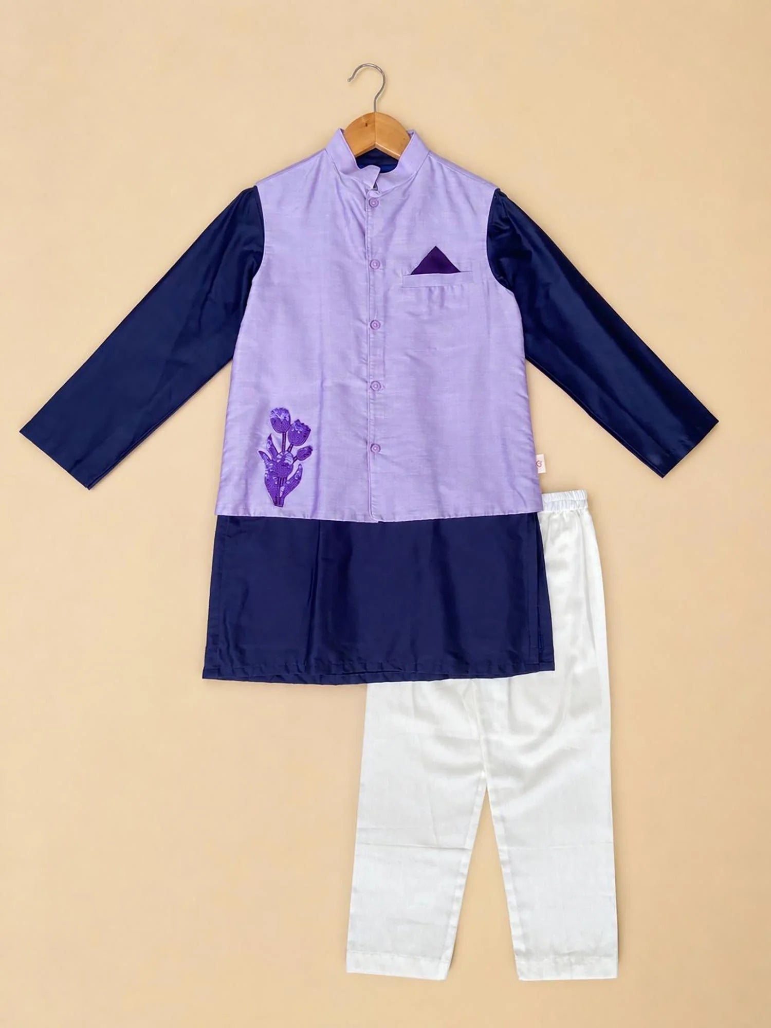 Boy wearing Storytellers Junior Rohan Lavender Jacket Set with navy accents and tulip embroidery